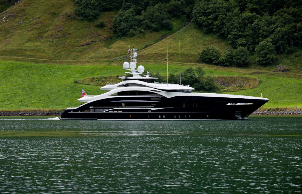 Heesen yachts ANN G side view at sea with green background