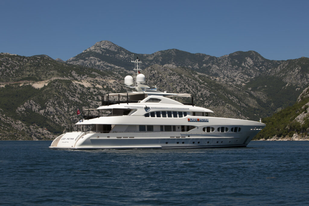 Heesen Yachts Lady Petra at sea side view with mountains