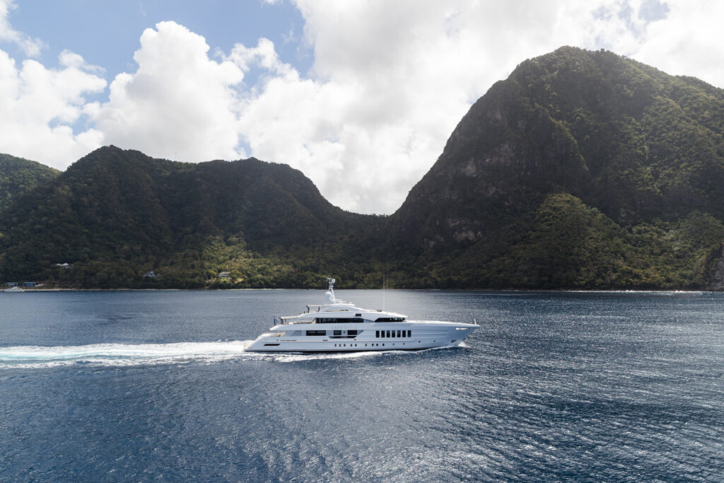 Heesen yachts Laurentia side view at sea with mountains