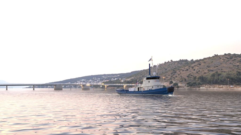 ammonia-powered tugboat render with landscape in the back Amogy